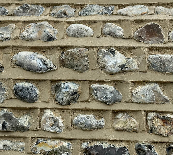 Flint and brick masonry wall